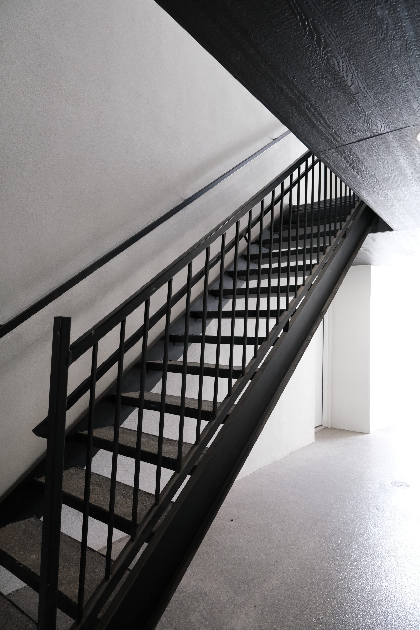 Steel staircase and stair railings in Brownsville, TX — multifamily fabrication by Torres Metals.